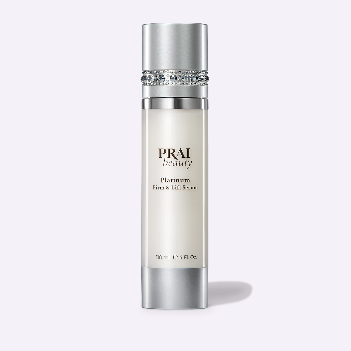 Serum bottle with jeweled band and silver cap, PRAI beauty Platinum Firm & Lift Serum, 118 mL