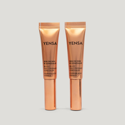 Skin concealer tube set with wand applicator, shown side by side in rose-gold packaging