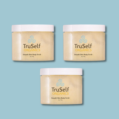 Three body scrub jars with white lids and beige contents, TruSelf Organics labels