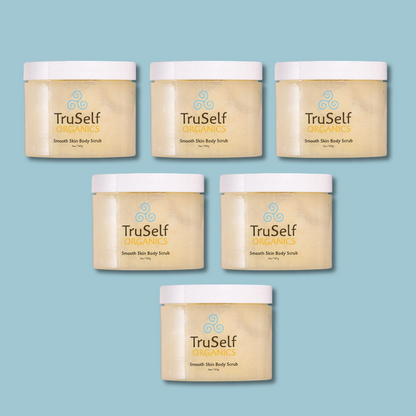 Set of body scrub jars with white lids, beige contents, TruSelf Organics labels