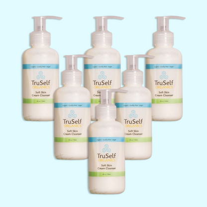 Set of six cream cleanser pump bottles, white containers with green label strip