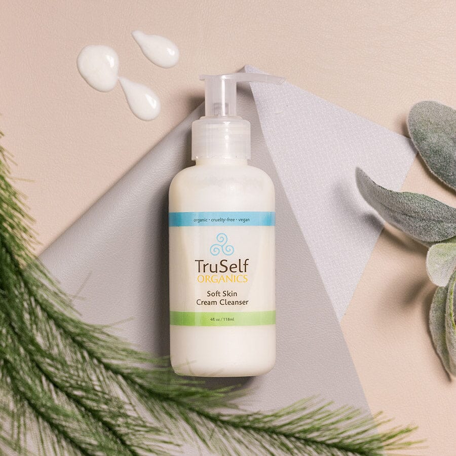 Cream cleanser bottle with pump, white container and green label strip