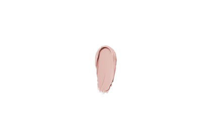 Creamy beige corrector swatch dollop on a dark background