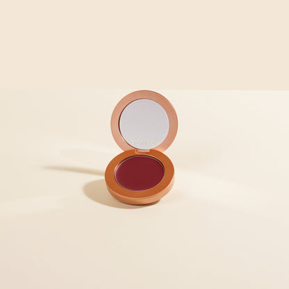 Cream blush compact with mirror open, berry-red pan