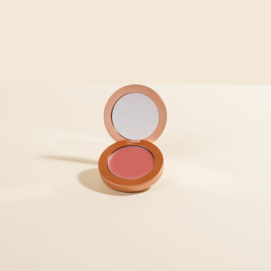 Cream blush compact with mauve-pink pan, open lid, YENSA logo
