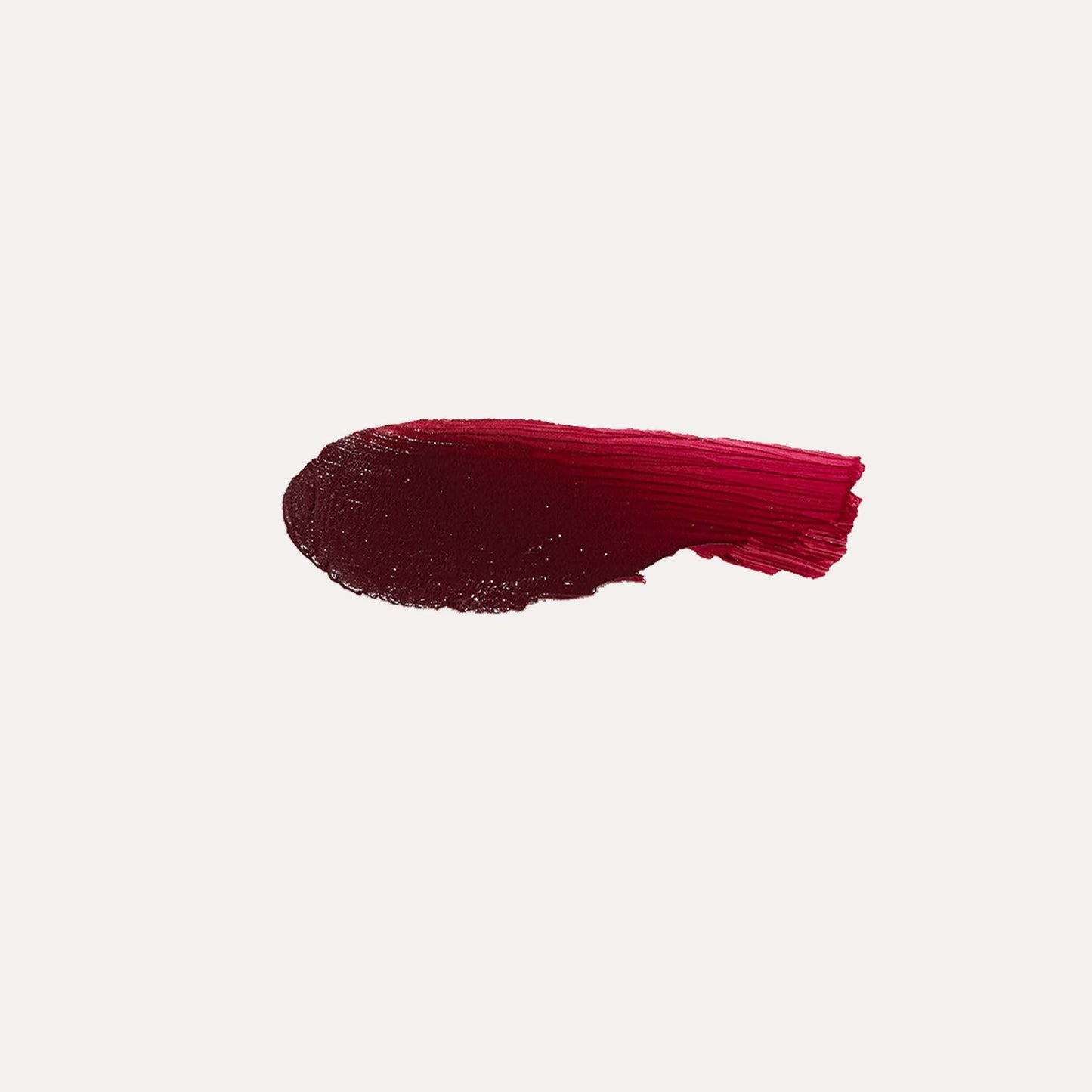 Cream blush shade swatch, deep berry-red smear