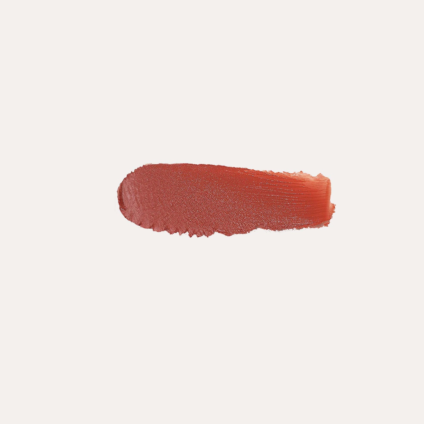 Cream blush swatch, coral-orange oval smear on a neutral background.