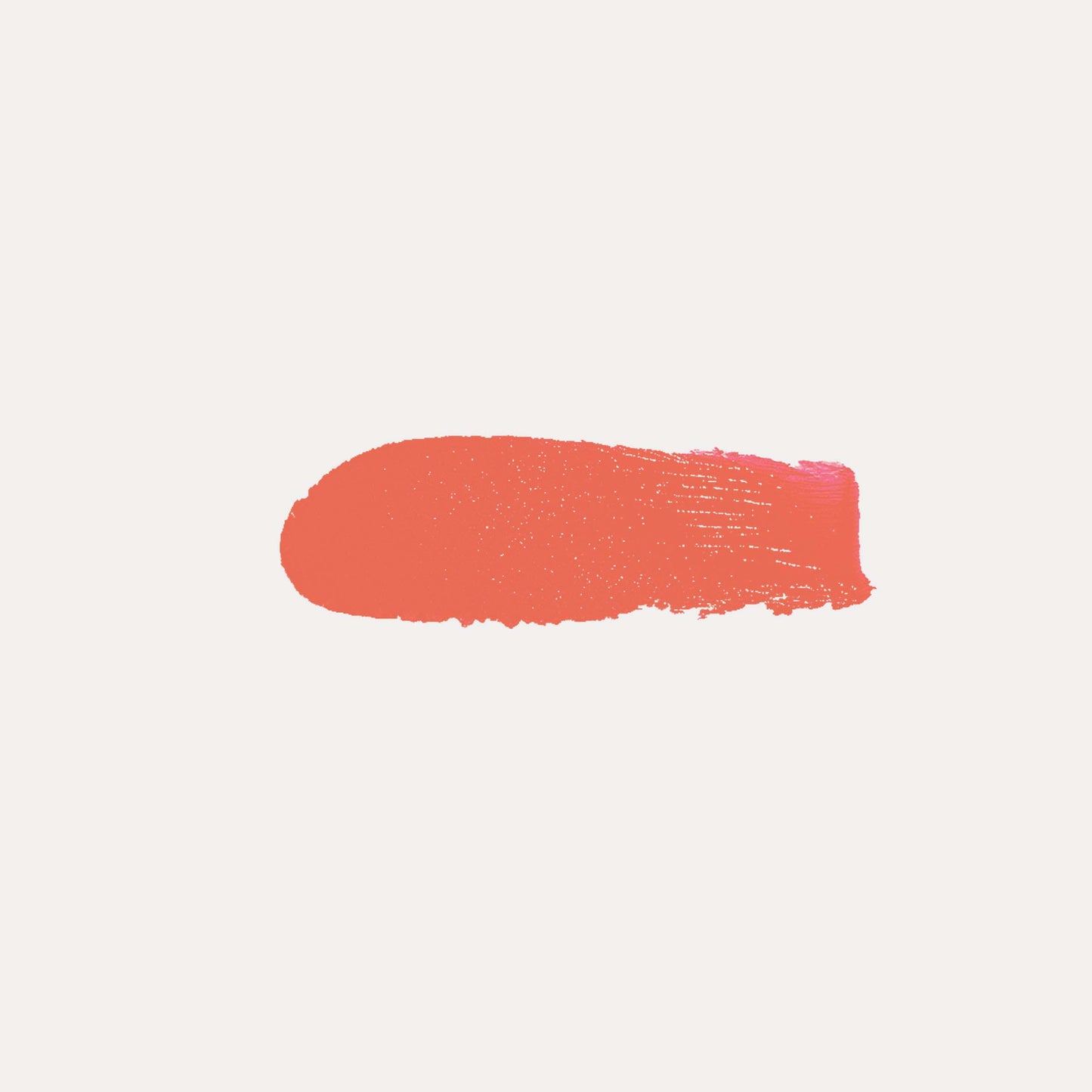 Cream blush swatch, warm coral-orange paint stroke on light background.