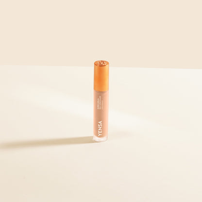 YENSA concealer serum bottle with gold cap, deeper beige liquid, upright