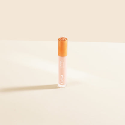 YENSA concealer serum bottle with gold cap, creamy beige liquid, upright