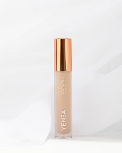 YENSA concealer serum bottle with gold cap, beige liquid in frosted tube