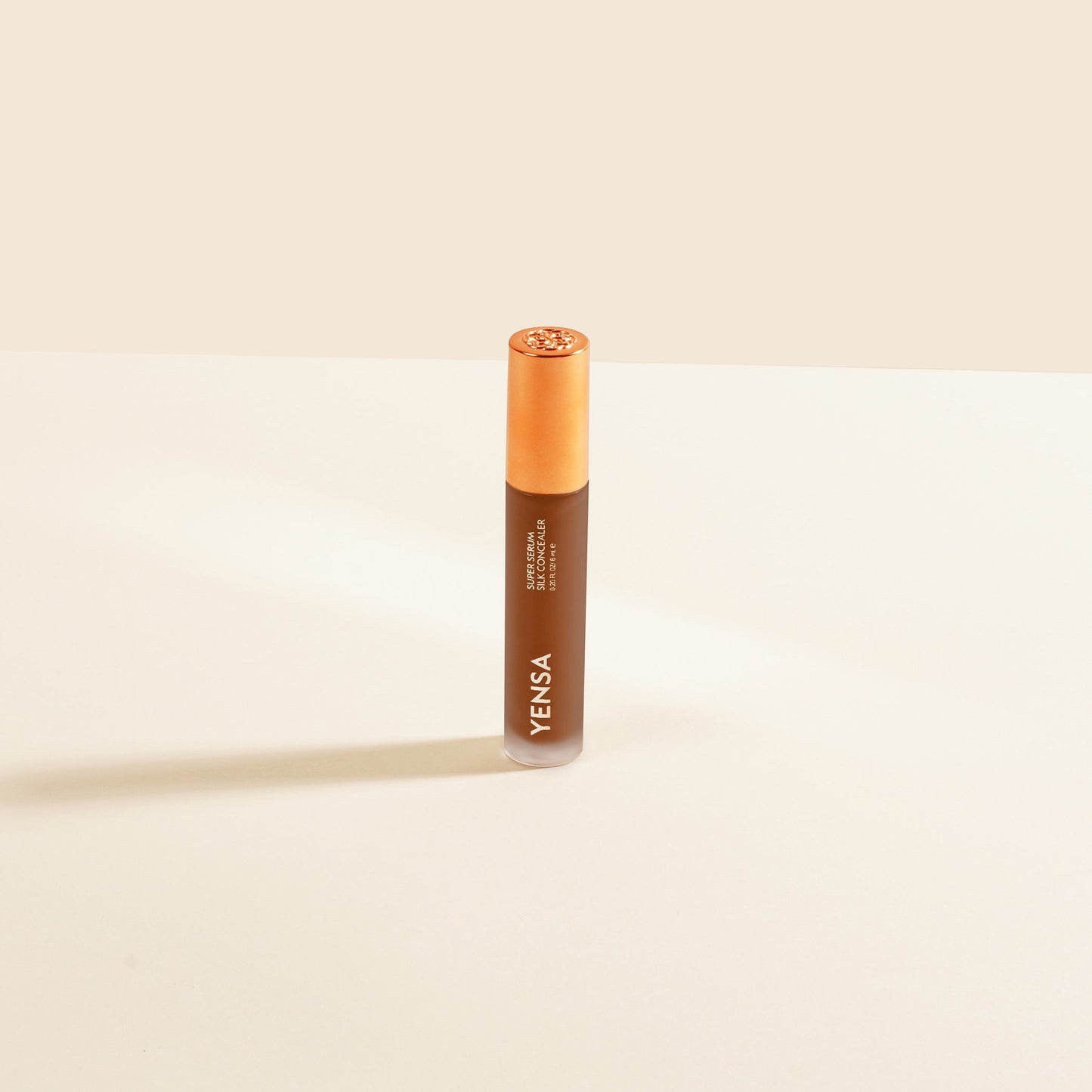 YENSA Super Serum Silk Concealer tube with bronze cap, liquid in squeeze applicator