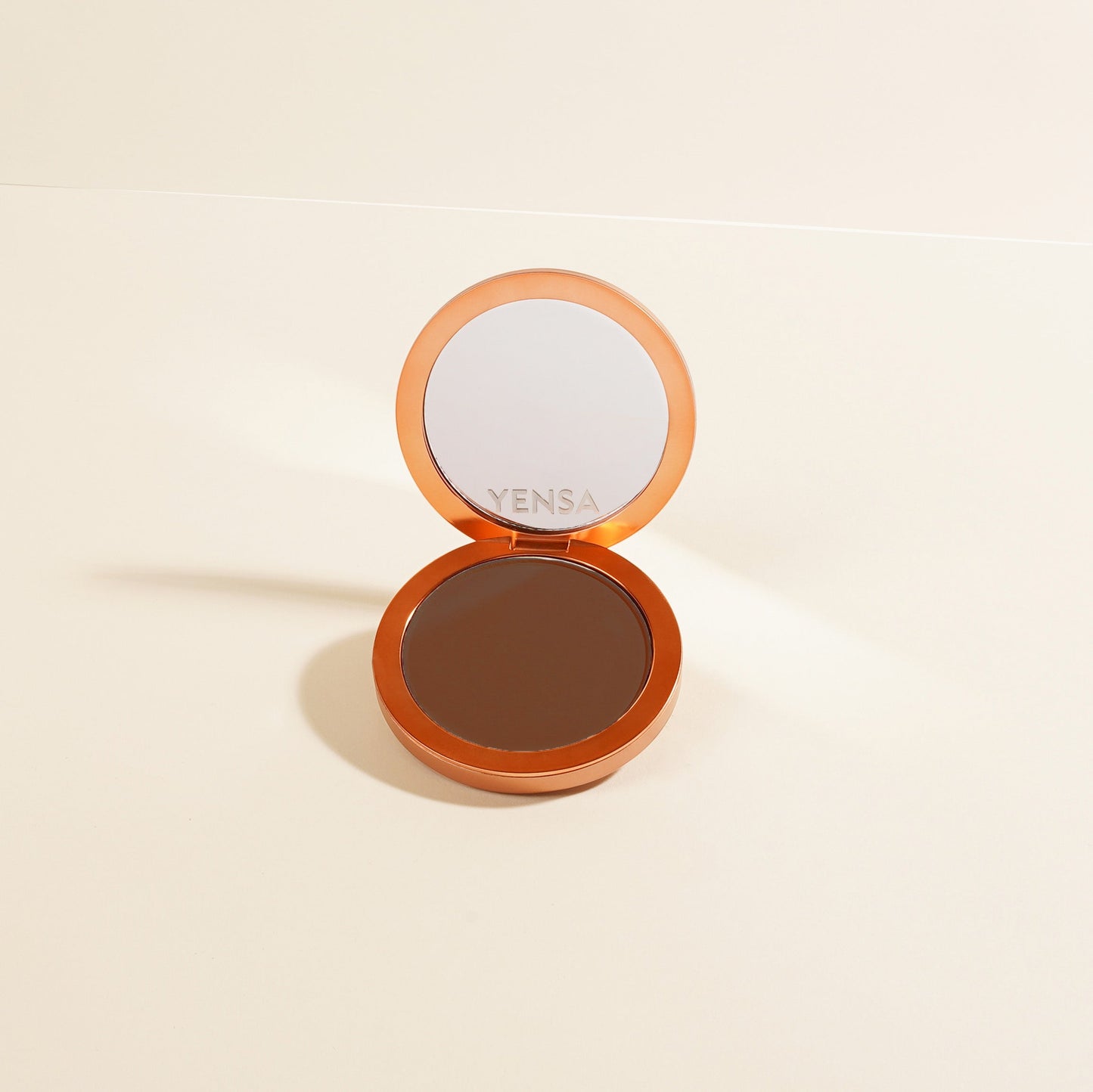 Vensa compact powder foundation with open lid and dark brown powder pan