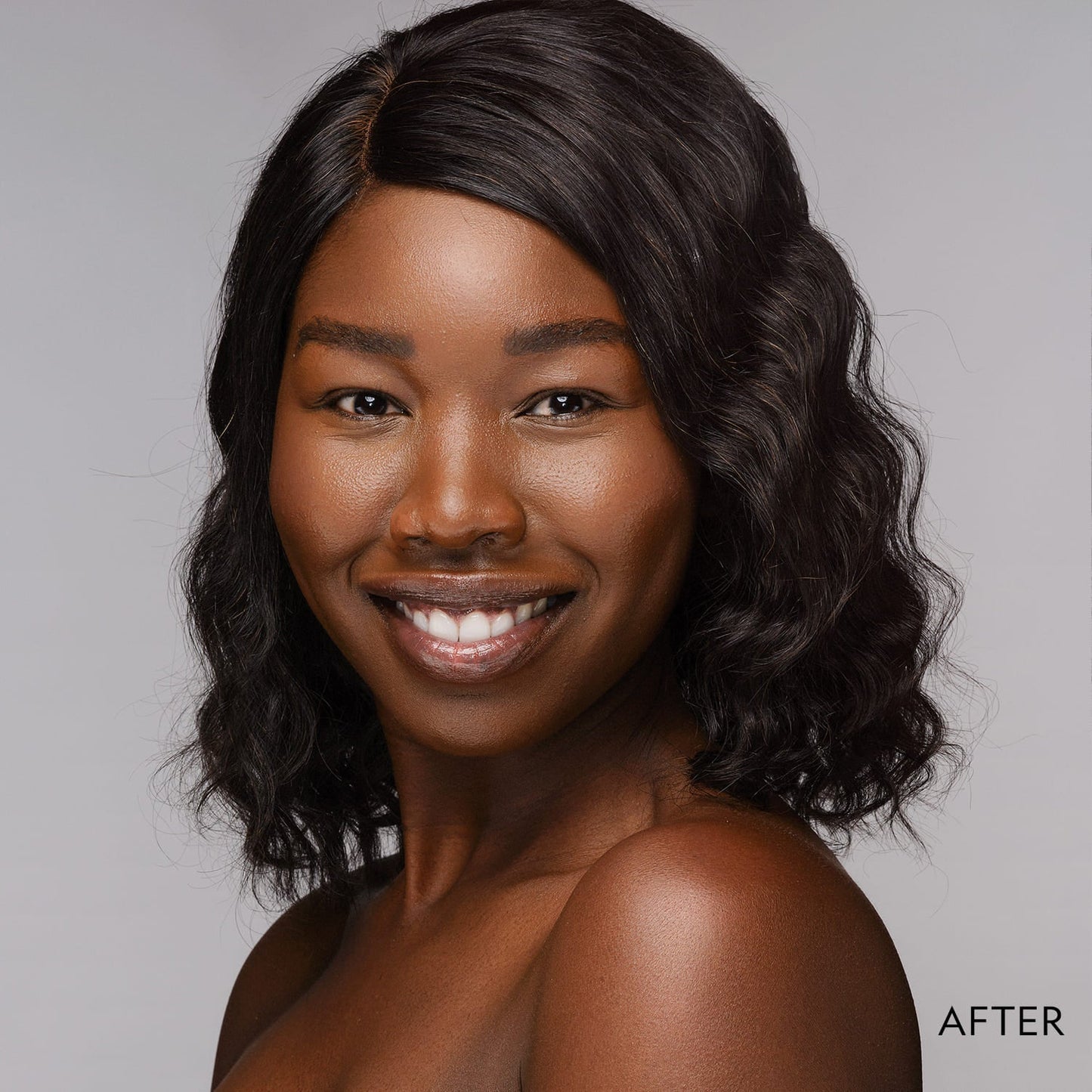 Model wearing powder foundation on face with even skin tone finish