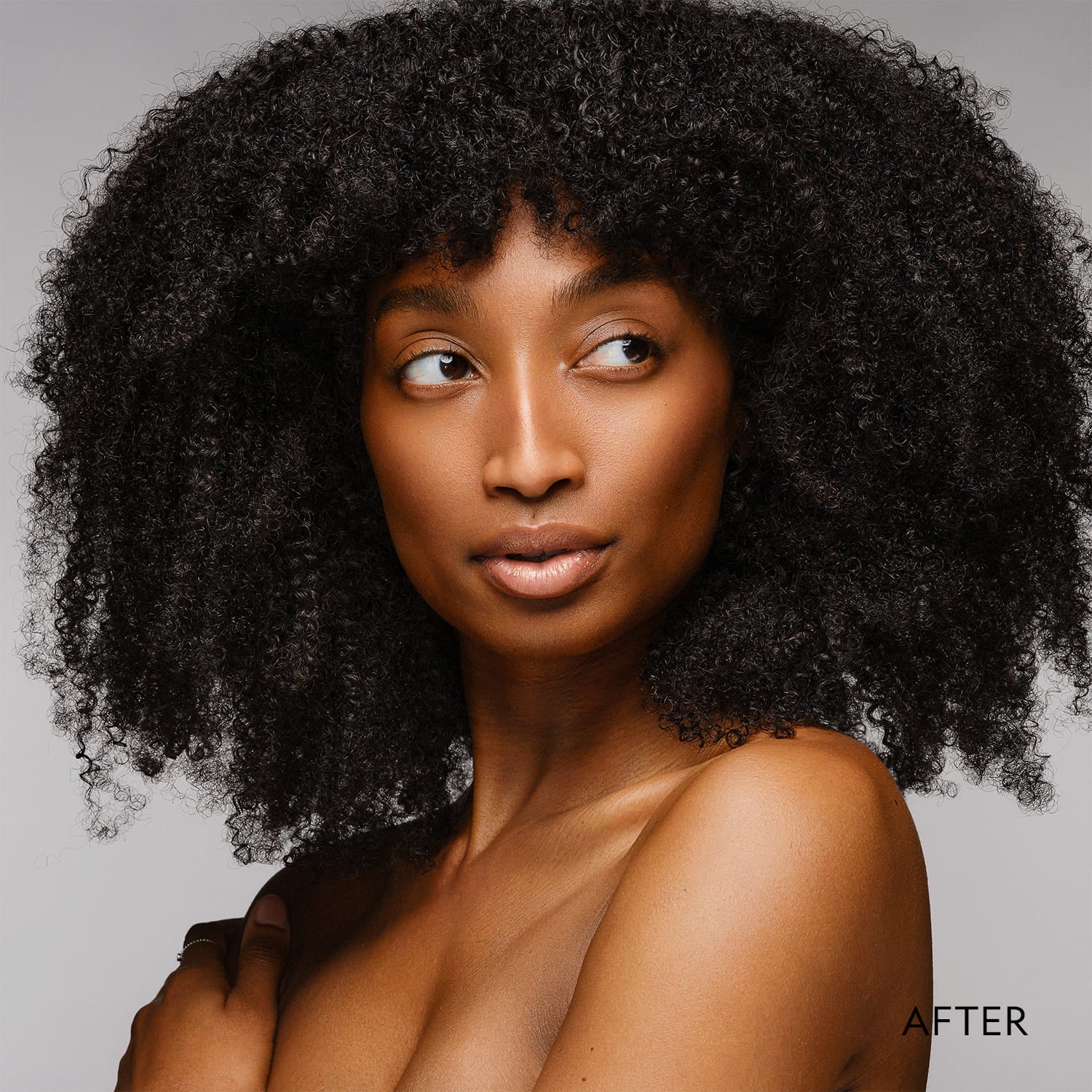 Model wearing matte powder foundation on face, showing smooth coverage