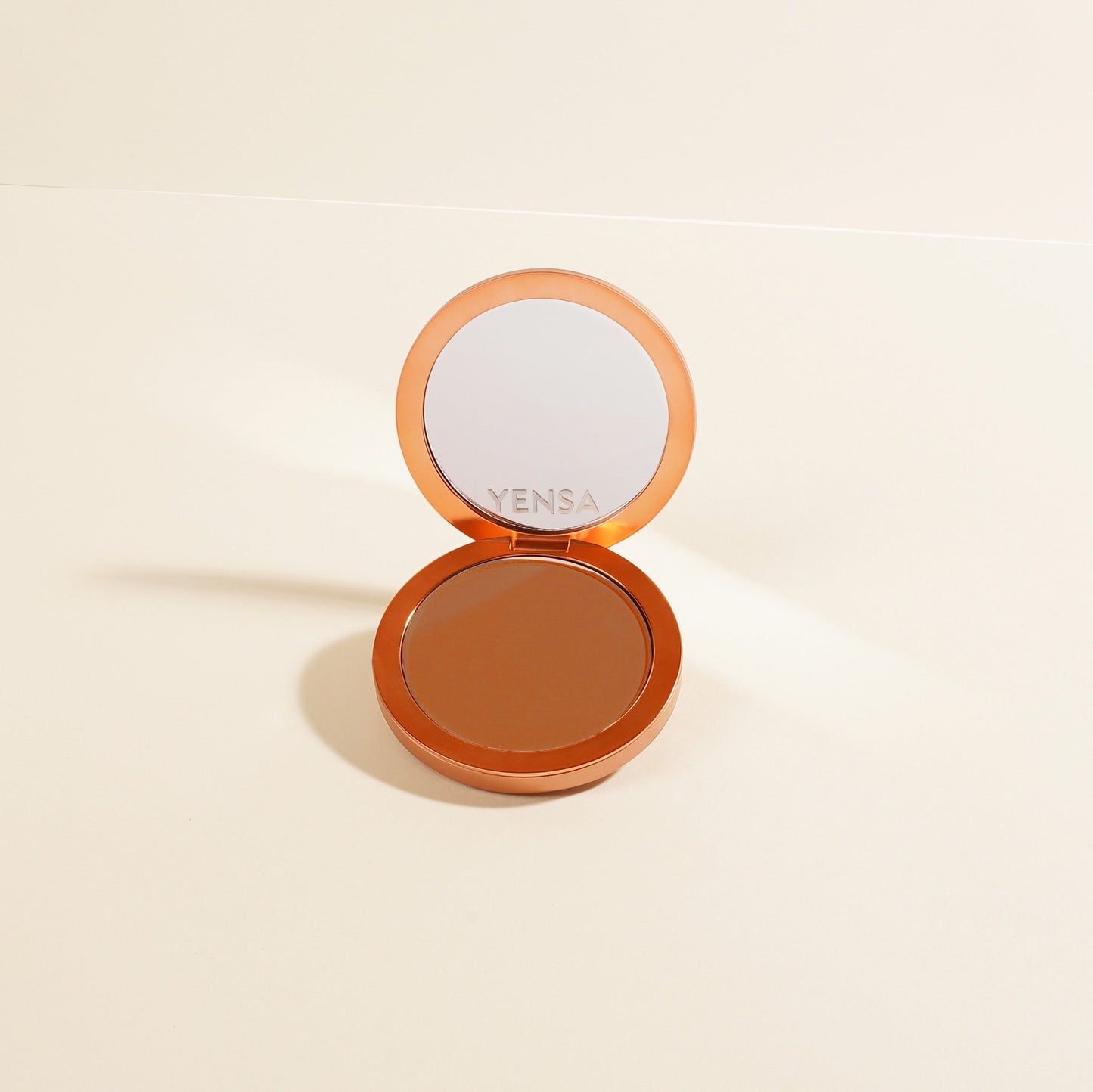 Vensa compact powder foundation with dark brown pressed shade, lid open
