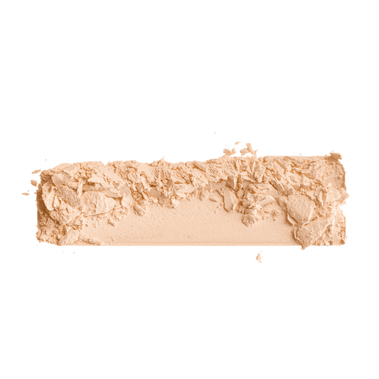 Powder foundation shade swatch, light peach-beige matte powder with textured surface