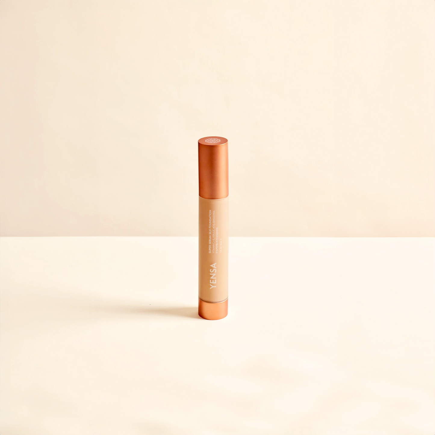 YENSA liquid foundation tube with orange cap and beige product body