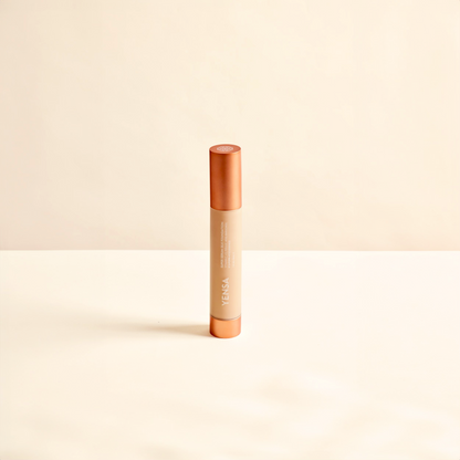 Hydrating foundation tube with orange cap and beige dispenser, front view