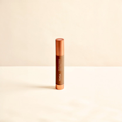 Slim liquid foundation tube with orange cap and vertical YENSA branding