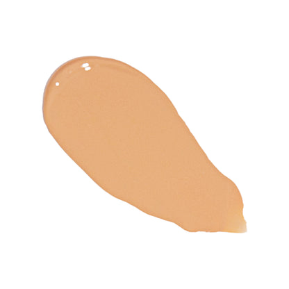 Peach-beige liquid foundation swatch smear with glossy finish
