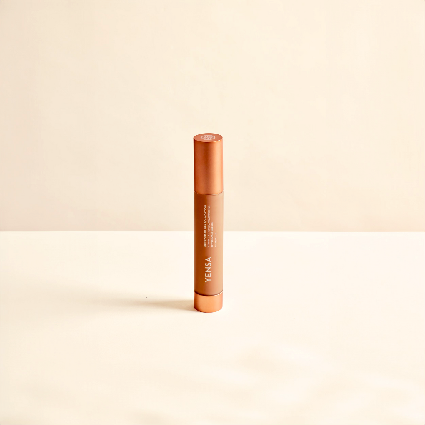 YENSA liquid foundation tube with orange cap and beige product body