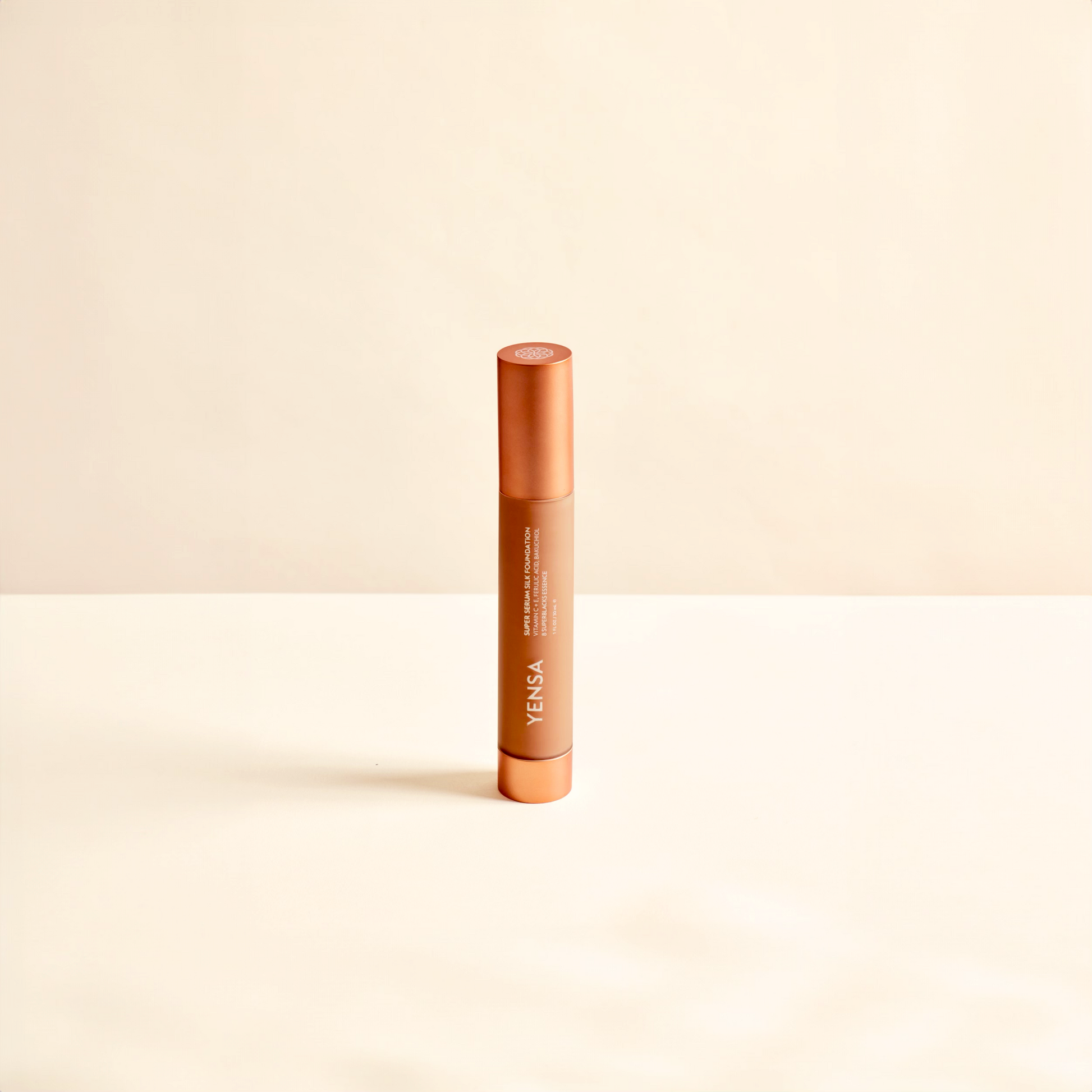 YENSA liquid foundation tube with orange cap and beige product body