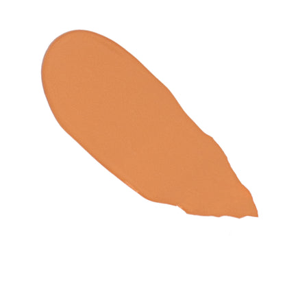 Tan orange liquid foundation swatch with smooth coverage