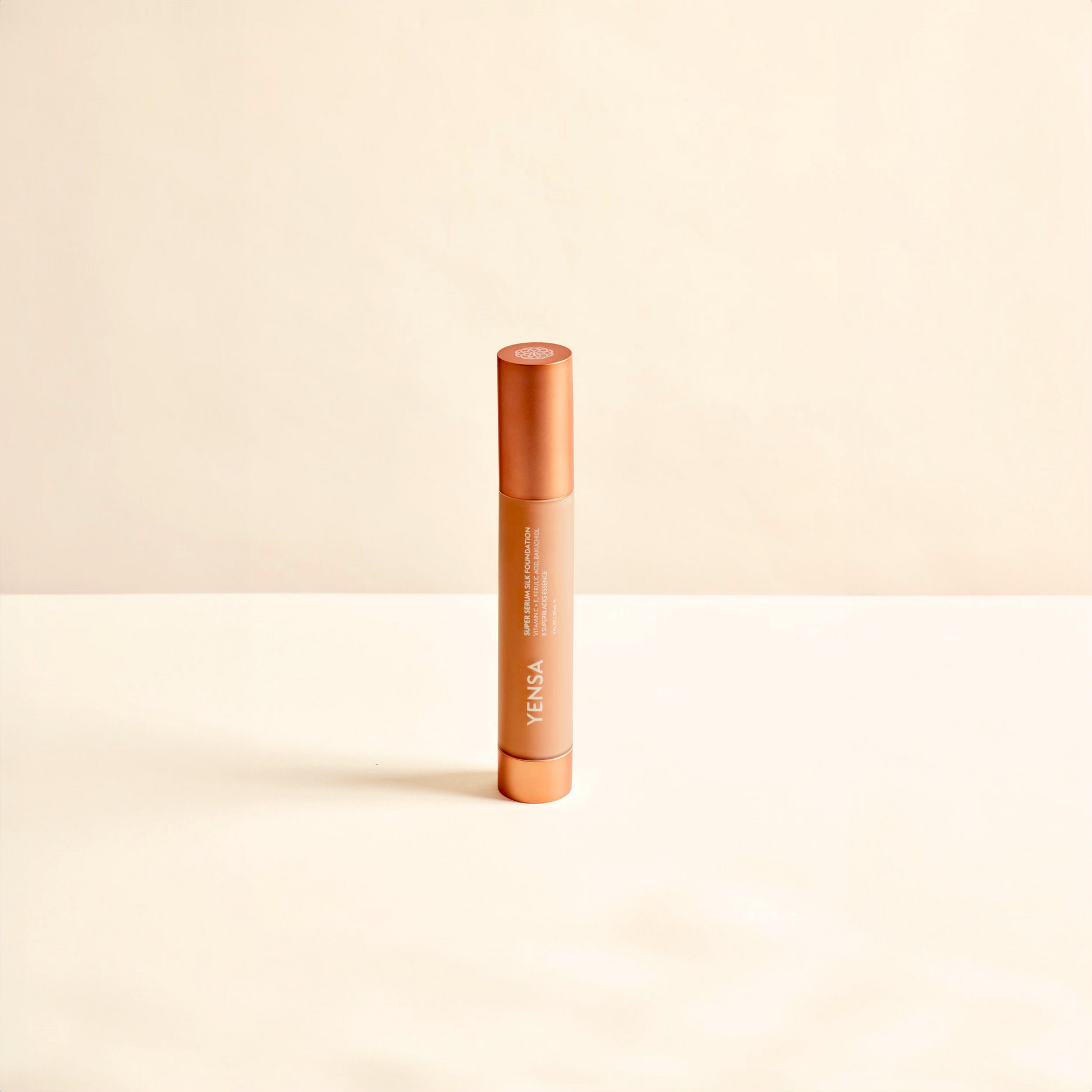 YENSA liquid foundation tube standing upright with orange cap