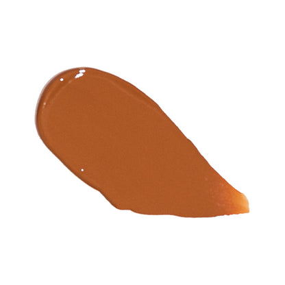 Foundation swatch in medium warm brown, smooth glossy smear