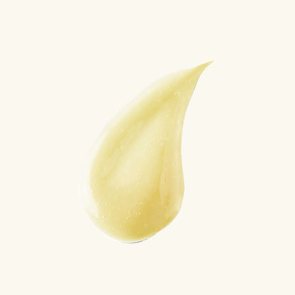 Single yellow serum drop with glossy texture