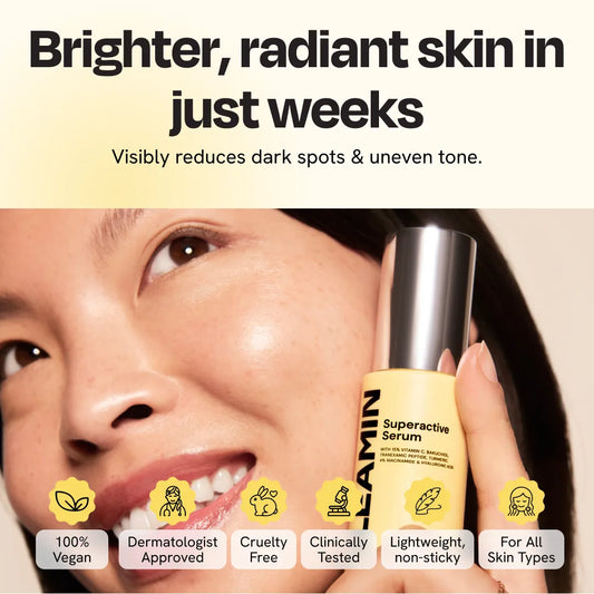 Face serum bottle held near a woman’s cheek for brightening treatment