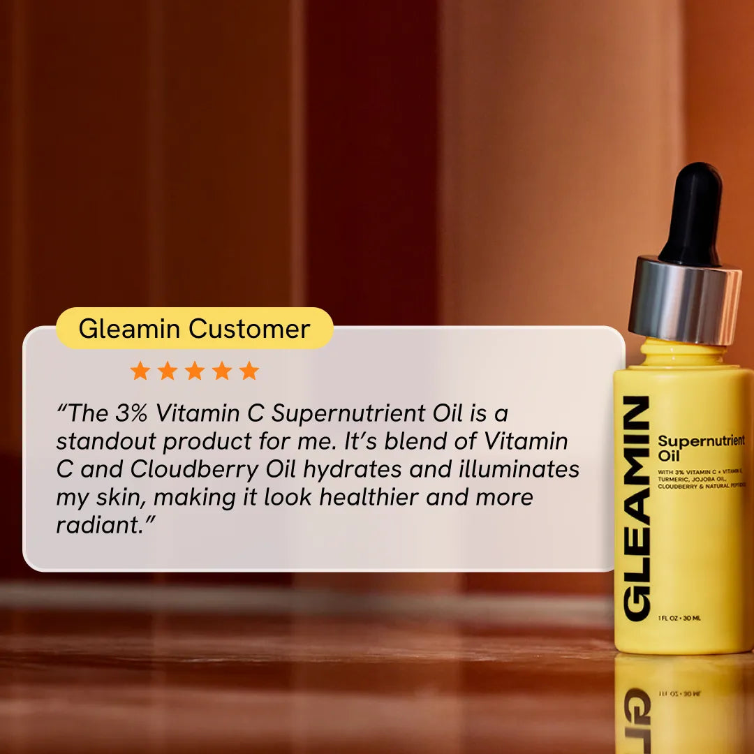 Hydrating facial oil bottle with black dropper, yellow-gold bottle with label