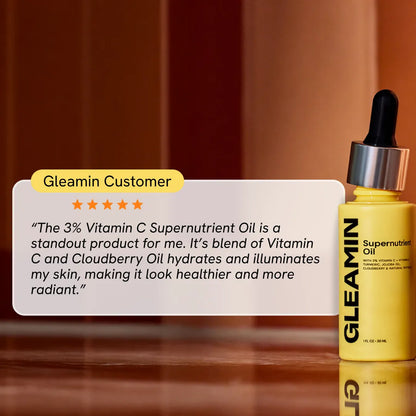 Hydrating facial oil bottle with black dropper, yellow-gold bottle with label