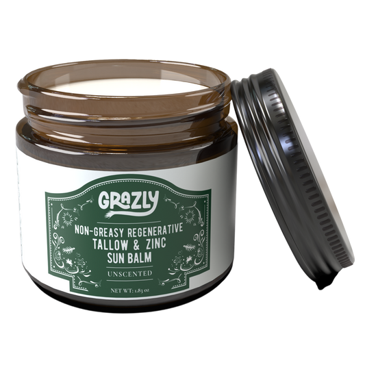 Sun balm jar with green label and open black applicator cap, unscented