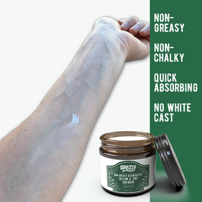 Sun balm jar beside forearm with white balm smear, unscented label