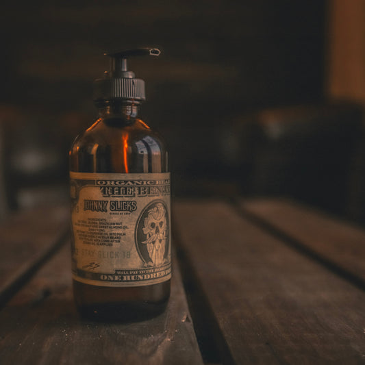Amber glass beard oil bottle with black pump, label for Benjamin by Johnny Slicks