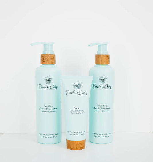 Baby skincare set: two light blue pump bottles and a cream tube with bamboo caps