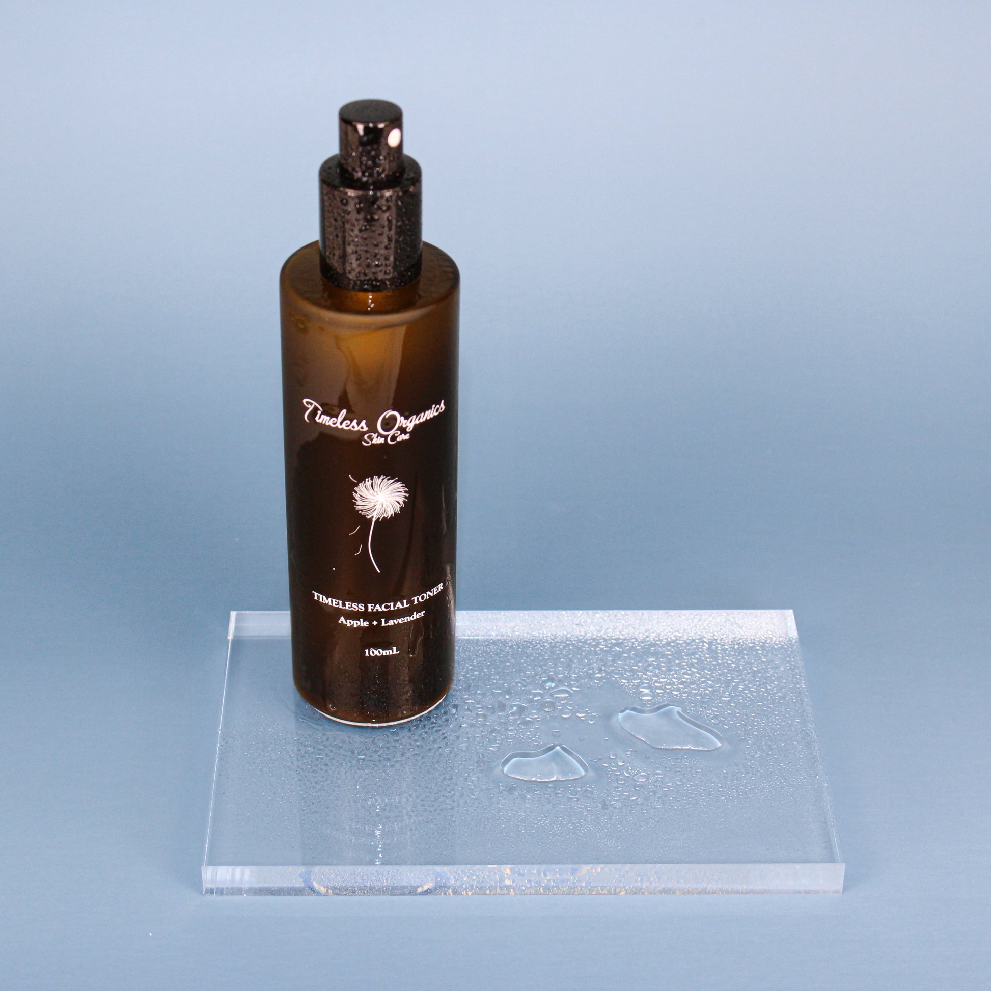 Facial toner bottle with black pump, Apple + Lavender, 100mL, on clear tray