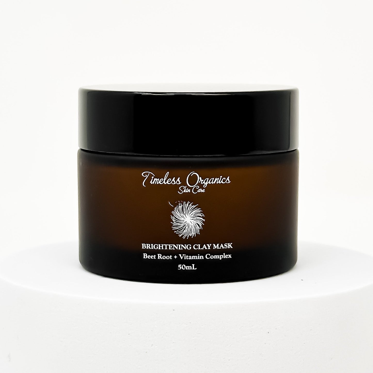 Brightening clay face mask jar, dark bottle with black lid and front label