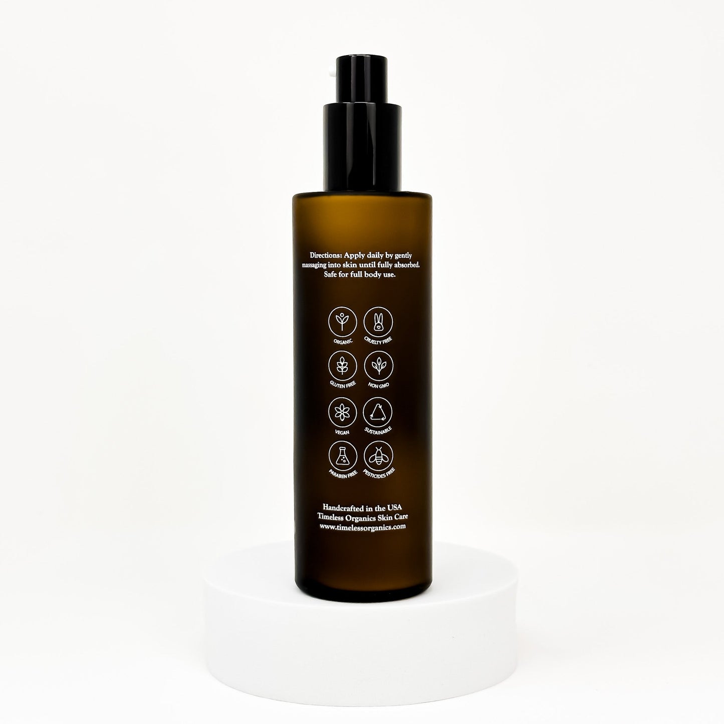 Clarifying acne lotion bottle with black pump and back label with icons