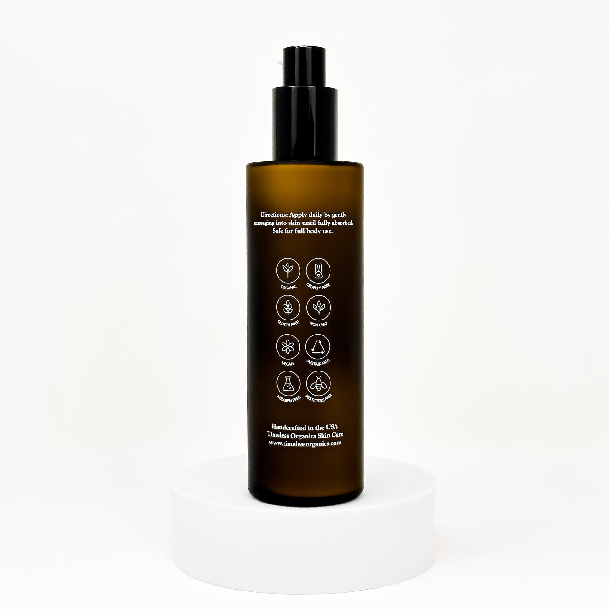 Clarifying acne lotion bottle with black pump and back label with icons