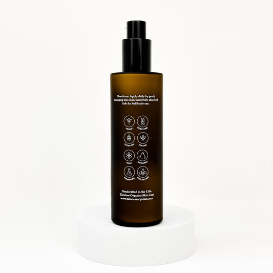 Clarifying acne lotion bottle with black pump and back label with icons