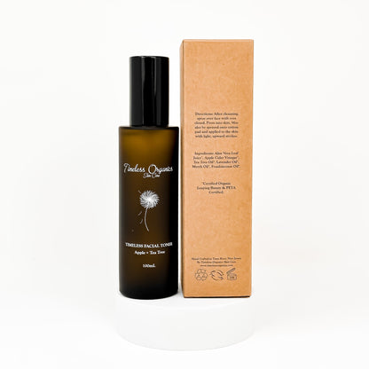 Clarifying facial toner bottle with black pump and amber body, with matching cardboard box
