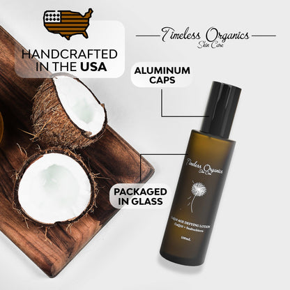 CoQ10 age defying face lotion bottle with black pump near coconut halves