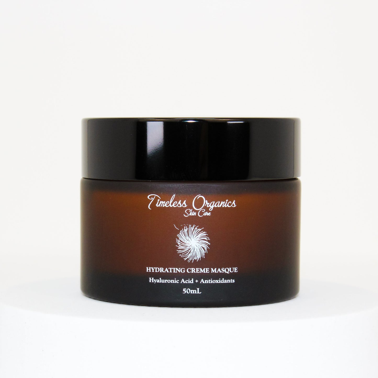 Hydrating face cream masque jar with black lid and amber-brown container