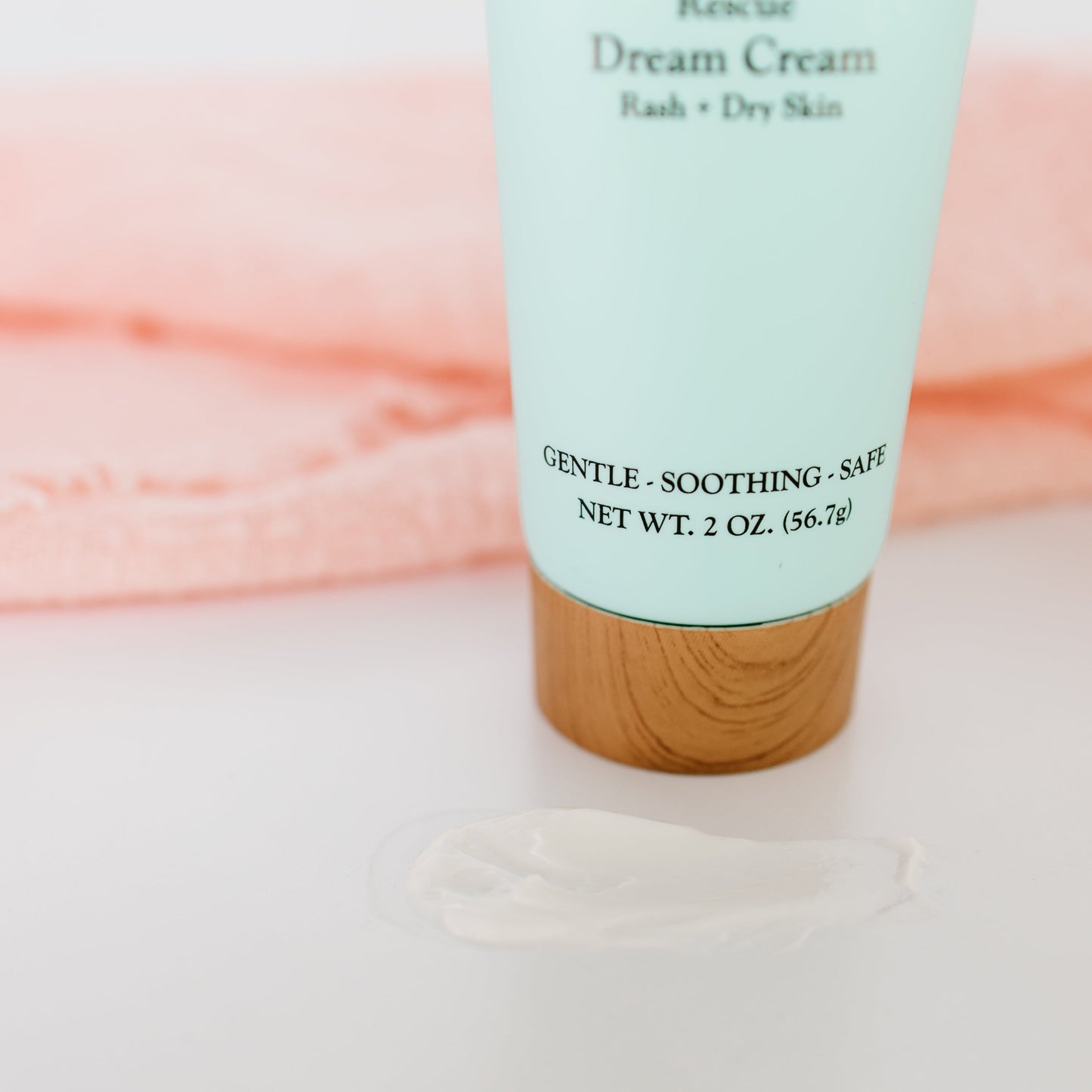Timeless Baby Dream Cream tube closeup with soft white cream dollop