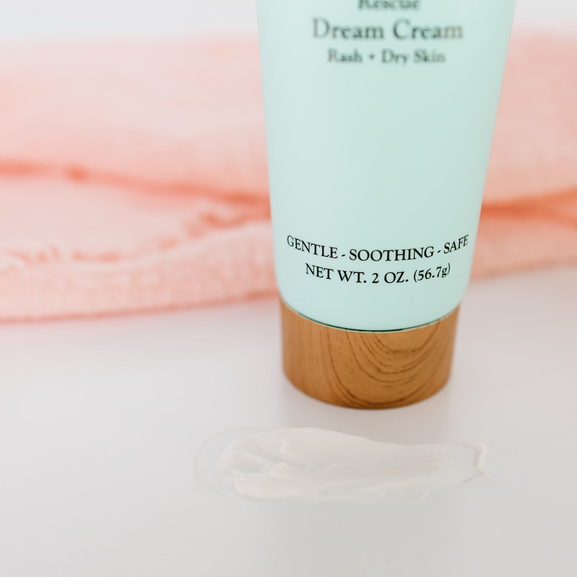 Timeless Baby Dream Cream tube closeup with soft white cream dollop