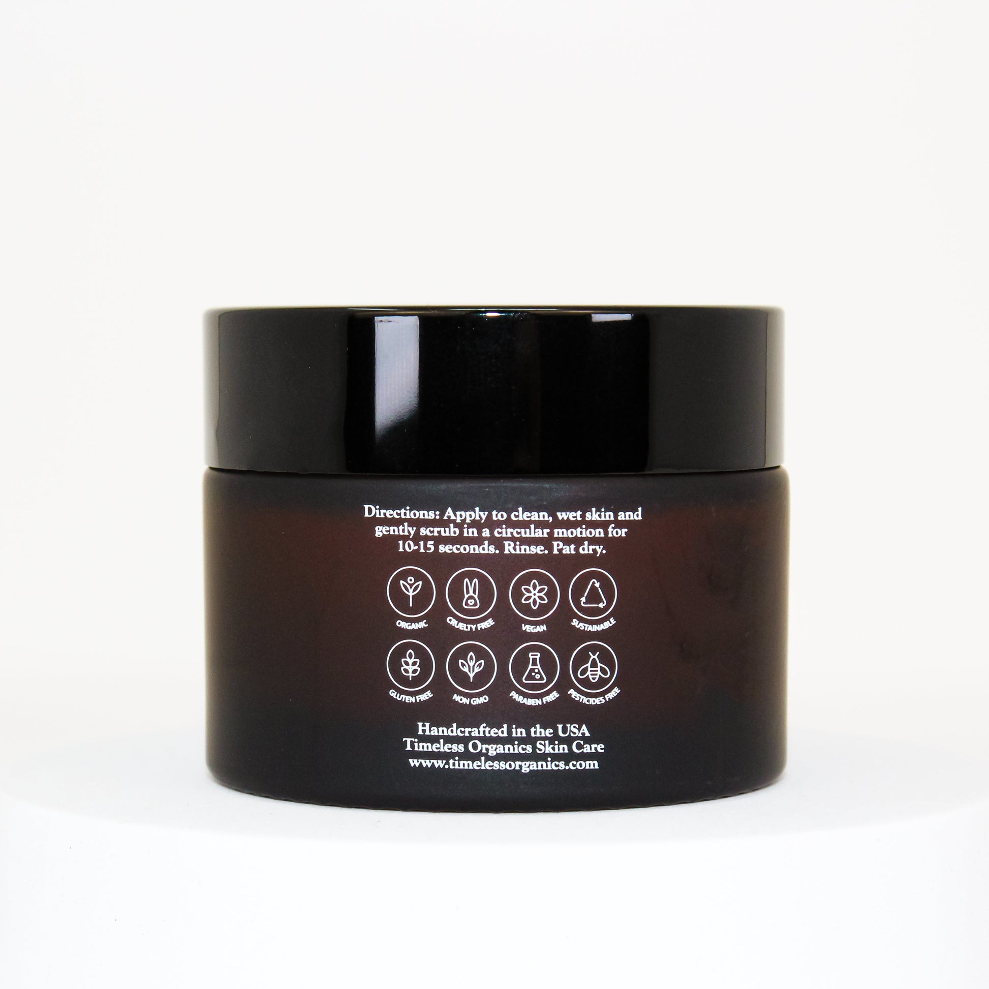 Timeless Organics exfoliating cream cleanser jar, black lid, back label with icons