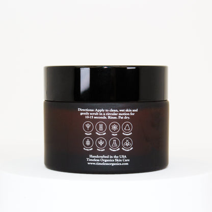 Timeless Organics exfoliating cream cleanser jar, black lid, back label with icons